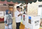 Bupati Madina dan Istri Mencoblos di TPS 002 Panyabungan II